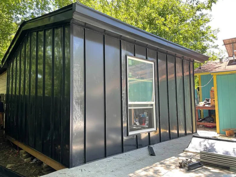 Black standing seam metal wall panels for Metal Roof Installation in Grosse Ile